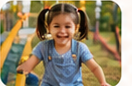 Smiling child enjoying outdoor play at the center